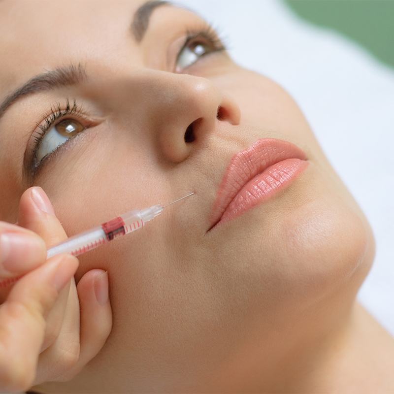 a woman getting botox injection