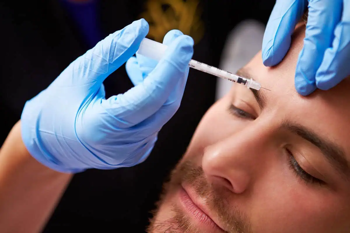 a man getting botox injection