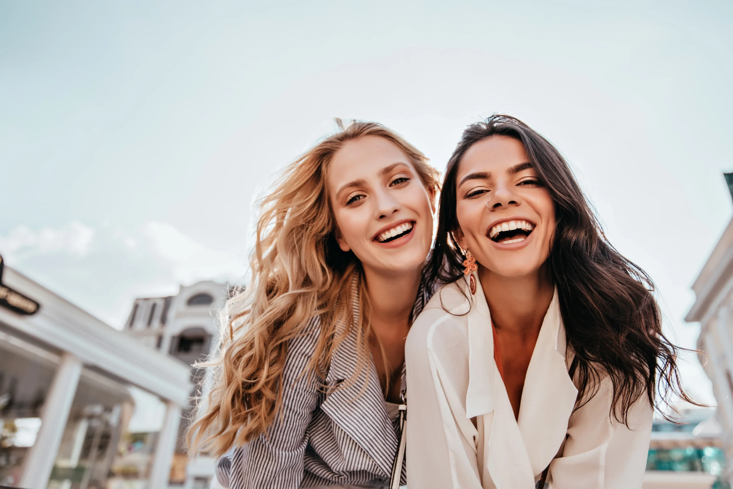 two women smiling at the camera