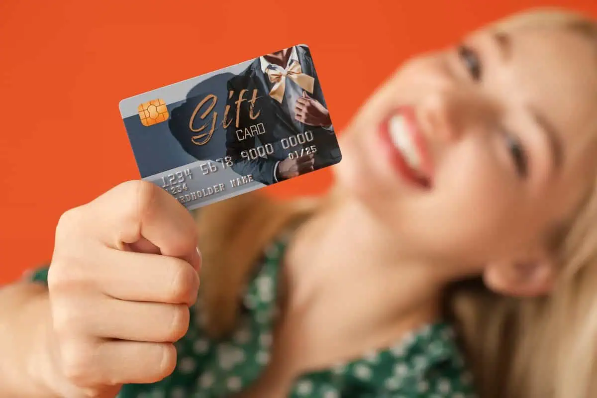 a woman holding a credit card