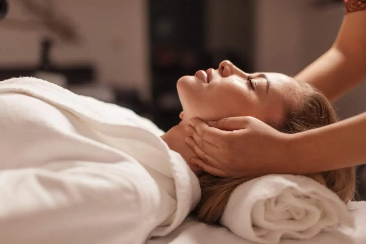 a woman lying down on a massage table