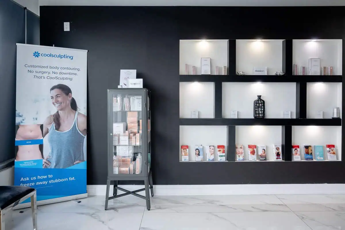 a display case with shelves and a sign